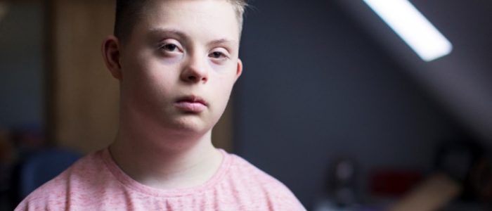 Young boy with pink shirt — Disability Support in Nelson Bay